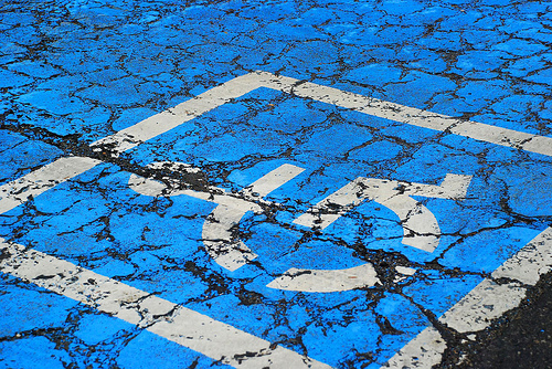 Disabled symbol on a cracked pavement