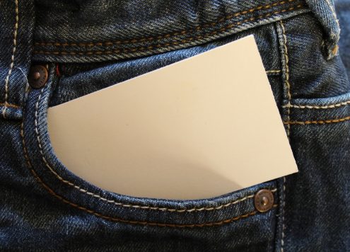 jeans with a piece of paper in the pockets