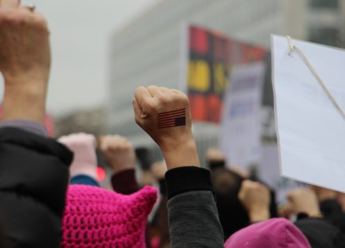 Fists raised at a protest