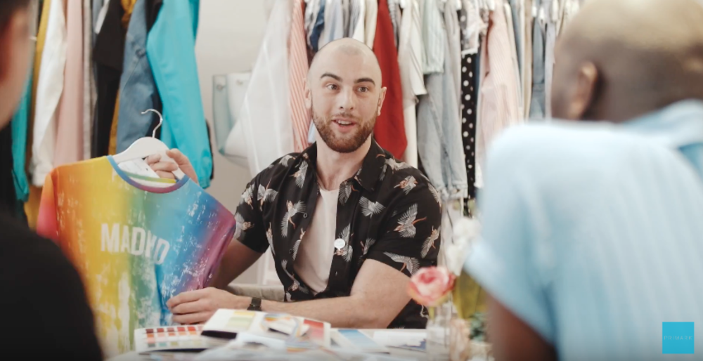 Screenshot from Primark and Stonewall's Pride merch launch featuring a bald and bearded man selling clothes.